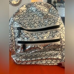 - Calvin Klein Backpack  new w tags, super light & comfortable, great for travel